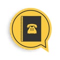 Black Phone book icon isolated on white background. Address book. Telephone directory. Yellow speech bubble symbol Royalty Free Stock Photo