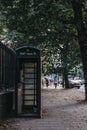 Black phone box on Euston Road in London, UK.