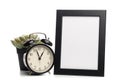 Black photo frame and clock isolated on white background, succulent behind Royalty Free Stock Photo