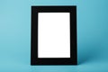Black photo frame with empty space on a blue background Royalty Free Stock Photo