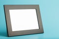 Black photo frame with free space on a blue background Royalty Free Stock Photo