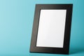 Black photo frame with free space on a blue background Royalty Free Stock Photo