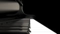 Black piano isolated on a black background - classical music Royalty Free Stock Photo