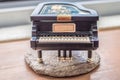 Black piano music box on wooden table Royalty Free Stock Photo