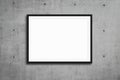 Black picture frame hanging on grey concrete wall, mockup Royalty Free Stock Photo