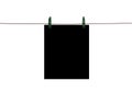 The black piece of paper hanging on rope with clothespins. Close Royalty Free Stock Photo