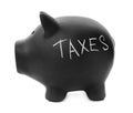 Black piggy bank with word TAXES Royalty Free Stock Photo