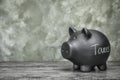 Black piggy bank with word TAXES Royalty Free Stock Photo