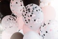 Black and pink balloons background, punchy pink pastel colored and soft focus