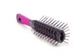 Hairbrush with plastic bristles closeup on a white background