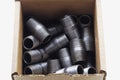 Black Pipe Fittings Boxed Royalty Free Stock Photo