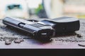 a black pistol lies on the window, an old found pistol, an airsoft gun Royalty Free Stock Photo