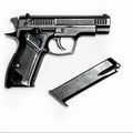 A black pistol with a magazine for cartridges lies on a white background Royalty Free Stock Photo