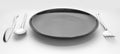 Black place setting with plate knife fork and spoon