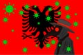 Black plague doctor surrounded by viruses with copy space with ALBANIA flag