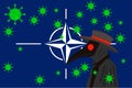 Black plague doctor surrounded by viruses with copy space with NATO flag Royalty Free Stock Photo