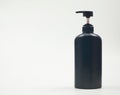 Black plastic bottle White background. Royalty Free Stock Photo