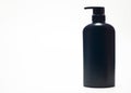 Black plastic bottle White background. Royalty Free Stock Photo