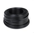 Black plastic cable coil, ideal for electrical or industrial use, isolated on a white background. Royalty Free Stock Photo