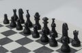 Black plastic Chess Pieces on natural wooden board, Chessboard selective focus of pawns and chess game set up Royalty Free Stock Photo