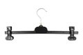 Black plastic clothes hanger on a white background. Top view Royalty Free Stock Photo