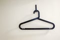 A black plastic coat hanger with a trouser bar Royalty Free Stock Photo