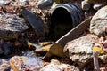 Black plastic culvert with runoff water surrounded by stones for erosion control Royalty Free Stock Photo