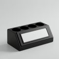 Black plastic desk organizer with a sloped front featuring a rectangular label space. Royalty Free Stock Photo