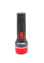Black plastic flashlight with red edge in vertical isolated on white background with clipping path Royalty Free Stock Photo