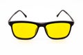 Black plastic frame yellow lens glasses, glasses isolated on white background Royalty Free Stock Photo