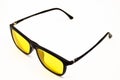 Black plastic frame yellow lens glasses, glasses isolated on white background Royalty Free Stock Photo