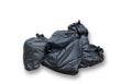 Black plastic garbage bags isolated on white background. Royalty Free Stock Photo