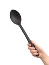 Black plastic ladle in hand, isolated on a white background photo Royalty Free Stock Photo