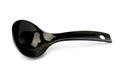 Black plastic ladle from a multicooker isolated on a white background