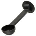 Black plastic measuring spoon for ground coffee, designed for coffee machine, with long handle and round base, isolated on Royalty Free Stock Photo