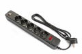 Black plastic power strip with 6 electrical outlets and USB charger Royalty Free Stock Photo