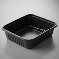 Black plastic rectangular food container with ribbed sides isolated on white background Royalty Free Stock Photo