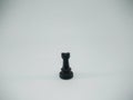 Black plastic rook chess piece isolated on a white background Royalty Free Stock Photo