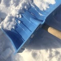 Blue plastic shovel for snow removal, snowdrift Royalty Free Stock Photo