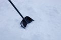 Black plastic shovel for snow removal