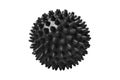 Black plastic spiny massage ball isolated on white. Concept of physiotherapy or fitness. Closeup of a colorful rubber