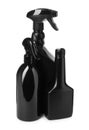 Black plastic spray bottles on white background Royalty Free Stock Photo