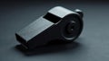 Black plastic whistle, textured surface, side view, white background, alert, safety Royalty Free Stock Photo