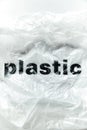 Black Plastic word on transparent white disposable plastic bag. Environment pollution problem concept image with copy space Royalty Free Stock Photo