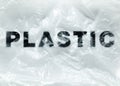 Black Plastic word on transparent white disposable plastic bag. Environment pollution problem concept image with copy space Royalty Free Stock Photo