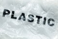 Black Plastic word on transparent white disposable plastic bag. Environment pollution problem concept image with copy space Royalty Free Stock Photo