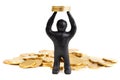 Black plasticine man with coins on his head isolated on a white background. Pile of money. Make money. Heap of coins. Royalty Free Stock Photo