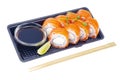 Black plate with rolls with salmon and soy sauce, Japanese cuisine Royalty Free Stock Photo