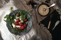 Black plate with strawberry on old white lace tablecloth. Royalty Free Stock Photo