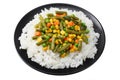 black plate with white rice, green peas, canned corn kernels, cut green beans isolated on white background Royalty Free Stock Photo
